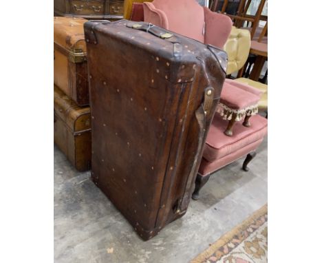 A Victorian leather copper and brass studded travelling trunk, length 94cm, depth 56cm, height 30cm