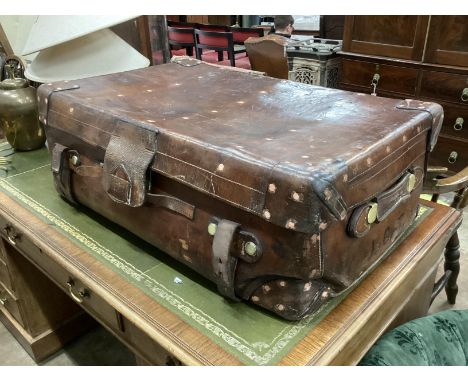 A Victorian leather brass and copper studded travelling trunk, width 86cm, depth 55cm, height 30cm