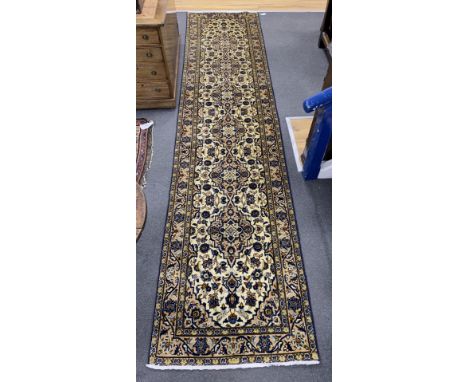 A North West Persian ivory ground runner, 400 x90cm