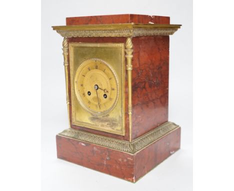 A French gilt metal mounted rouge marble mantel clock, first half 19th century, engine turned dial, 27cm high