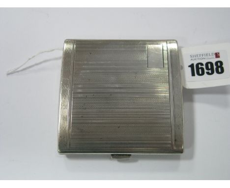 A Hallmarked Silver Cigarette Case, of rectangular form, allover engine turned.