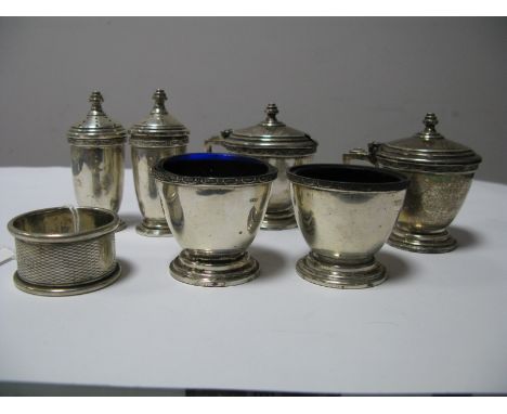 A Matched Hallmarked Silver Six Piece Cruet Set, of plain design, a hallmarked silver napkin ring, engine turned.