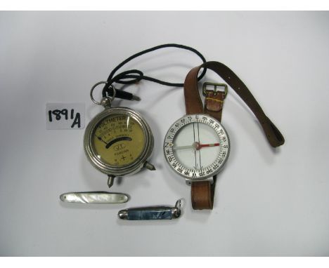 A Voltmeter, a large compass on strap and two small pocket knives.