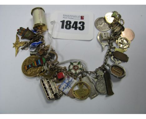  Curb Bracelet, suspending numerous charms, including a George V 1912 half sovereign pendant, an RAF Wings charm stamped "9ct