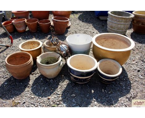 A quantity of ceramic plant pots and a metal shaped garden beetle