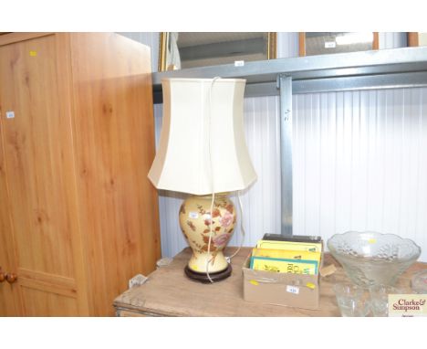 An Oriental decorated table lamp and shade 