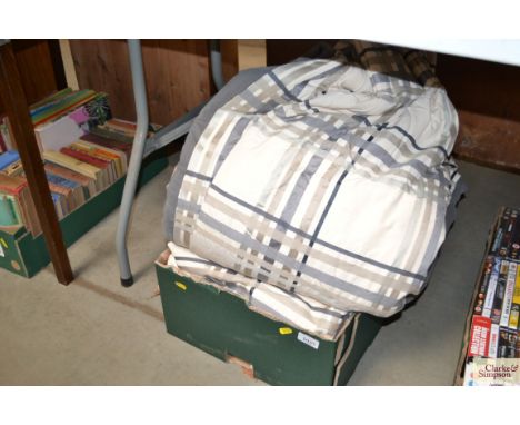 A box containing lined curtains