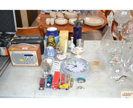 A claret jug together with various candles; wall clock; small quantity of diecast vehicles; trinket box etc