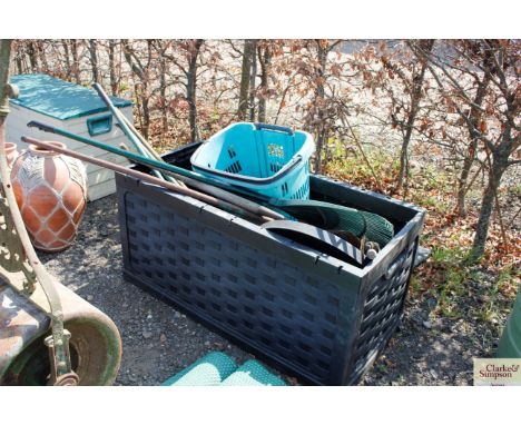A plastic tool box and contents of garden tools