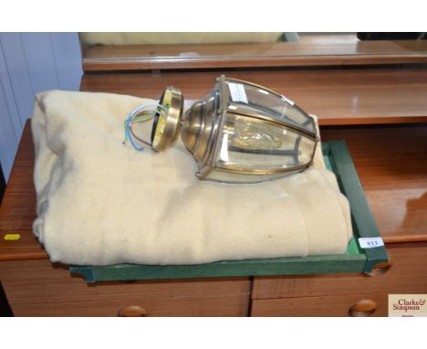 A brass and glass hanging light fitting 