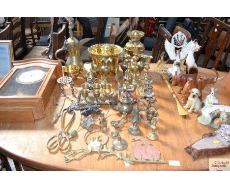 A quantity of brassware to include candle sticks; vases; jardiniere; coffee pot; oil lamp; miniature balance scales; tongs; p