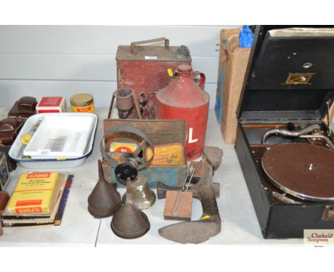 A Esso petrol can with fuel cap, one other petrol can, vintage blow lamp, various vintage tins, funnels, shoe last, lead moul