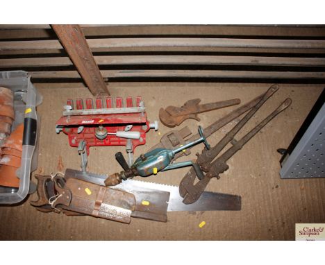 A quantity of tools including Stilsons saws; Dovetail jig etc 