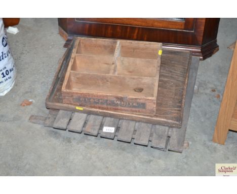 An advertising crate for Black &amp; White Scotch whisky; a twin handled tray and a teak folding table
