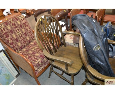 A pair of stick and wheel back carver chairs