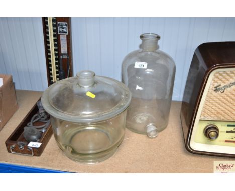 A glass jar and cover; and a glass flask