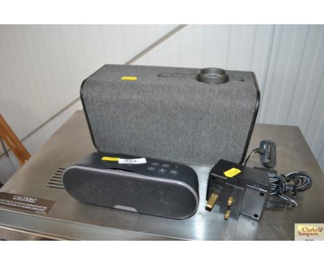 A Sony portable speaker, and one other portable speaker 