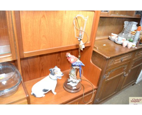 A table lamp decorated with a parrot; and a model dog 