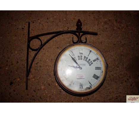 An outdoor two sided Gare De Paris Station wall clock