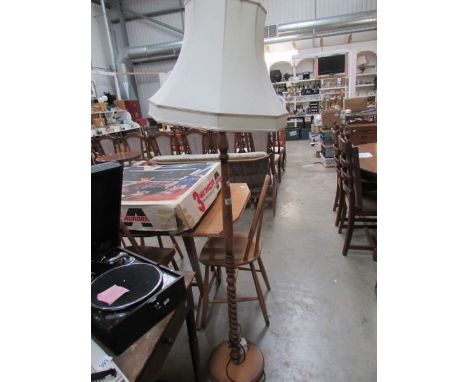 An oak standard lamp with shade