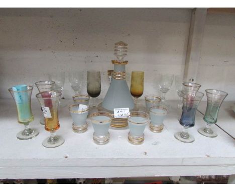 A decanter and a quantity of glasses