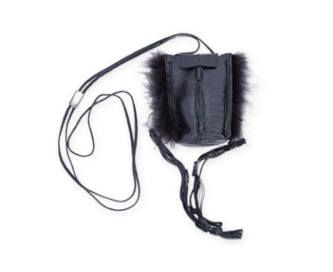 A GUCCI LEATHER EMBOSSED HANDBAG WITH FUR DETAILING
Comprising a black leather embossed alligator skin bag with mink fur deta