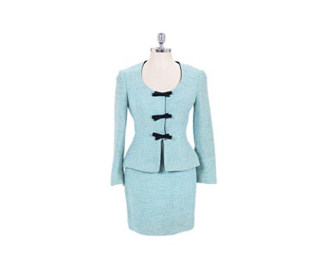 A CHRISTIAN DIOR TWO-PIECE SKIRT SUIT Comprising pale mint textured fabric, with a scoop neckline, black bow embellishments, 