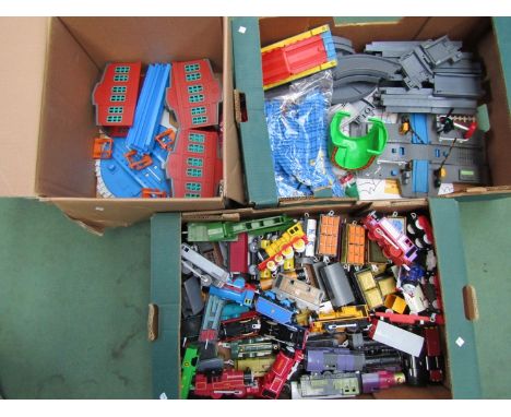 A box of Thomas &amp; Friends locomotives and rolling stock together with engine sheds, track etc 