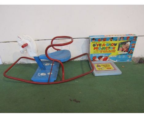 A vintage metal rocking horse, Chad Valley "Give-A-Show" projector and John Bull Printing Outfit 