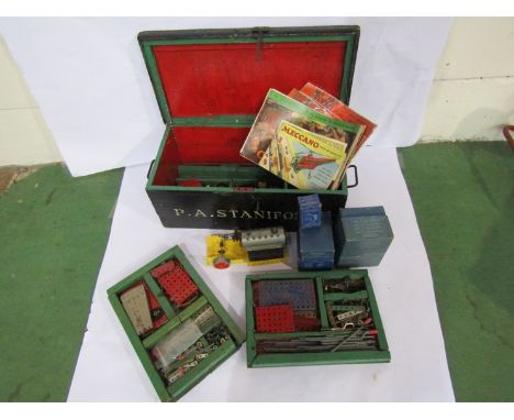 A collection of 1950's Meccano including boxed clockwork and electric motors, T20M transformer, steam engine etc housed in wo