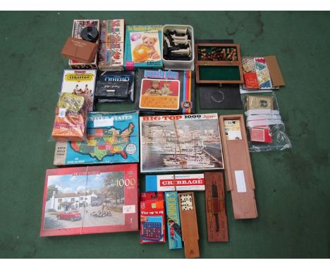 A large collection of mixed games and puzzles including Lexcon, dominoes, cribbage, Rummikub, jigsaw puzzles etc 