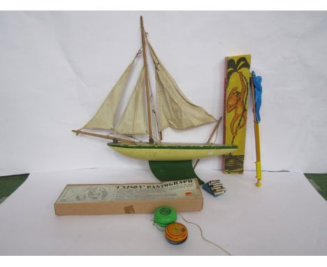 Mixed vintage toys including pond yacht, yo-yos, circus monkey, pantograph etc