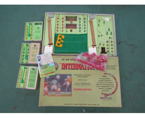A 1970's Subbuteo "International" set and three boxed teams to include Blackpool, Brazil and Norwich