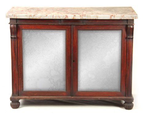 AN EARLY 19TH CENTURY ROSEWOOD CABINET IN THE MANNER OF GILLOWS having a thick cut veined marble top with a moulded reeded ed