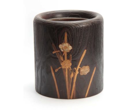 A JAPANESE MEIJI PERIOD ELM HIBACHI ( BRAZIER ) having a cylindrical body with emphasized wooden grain and mother-of-pearl in