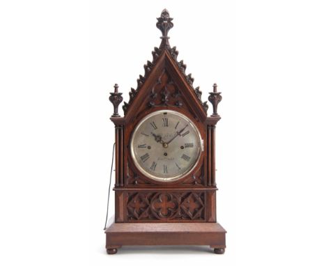 M. BEAL, SHEFFIELD A GOTHIC OAK CASED TRIPLE FUSEE BRACKET CLOCK the case with gothic carved panels and architectural pedimen