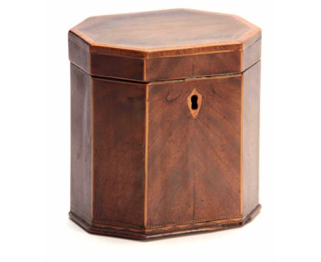 A GEORGE III FLAMED MAHOGANY OCTAGONAL SHAPED TEA CADDY with cross-banded and boxwood edges, having a hinged lid revealing a 