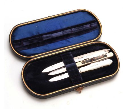 A CASED GROUP OF THREE PEN-KNIVES comprising A Mother of Pearl handled example; a tortoiseshell inset example and a silver po