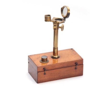 A LATE 19th CENTURY PORTABLE MICROSCOPE having a hinged mahogany box with brass threaded fitting opening to reveal a lacquere