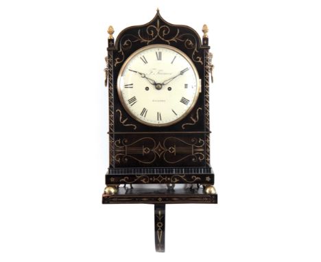 F. FARMER. ROCHFORD A REGENCY EBONISED AND BRASS INLAID BRACKET CLOCK WITH BRACKET having a shaped pediment and inlaid scroll