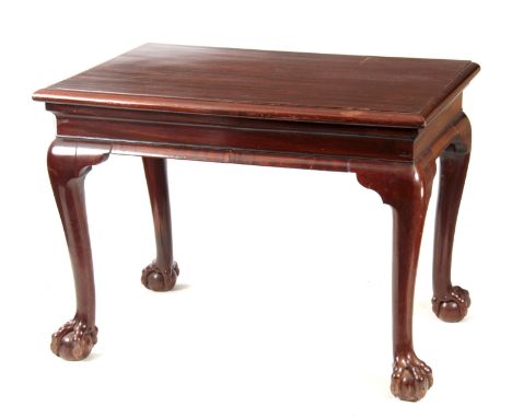 A GEORGE II IRISH MAHOGANY CONSOLE TABLE with shaped shallow frieze; standing on bulbous shaped cabriole legs with ball and c