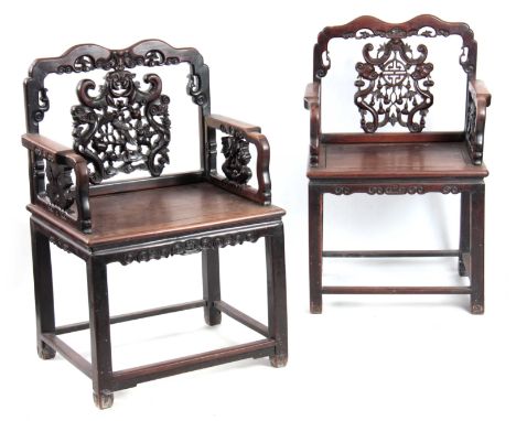 TWO SIMILAR 18TH/ 19TH  CENTURY CHINESE HARDWOOD OPEN ARMCHAIRS each with pierced carved shaped backs above centre panels of 