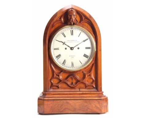 CHARLES FRODSHAM, CLOCK MAKER TO THE QUEEN, 84. STRAND. 1305. A GOTHIC STYLE WALNUT CASED BRACKET CLOCK having a lancet top a