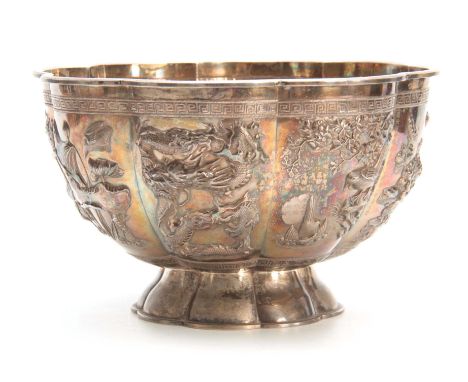 A LARGE CHINESE SILVER BOWL with gilt interior having embossed foliate panels depicting birds, butterflies, entwined dragons 