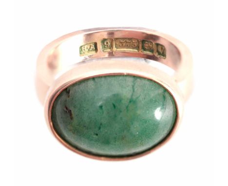 A 9ct .375 hallmarked YELLOW GOLD DRESS RING with large oval cushion shaped jade stone inset