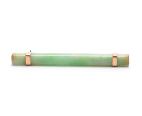 A JADE AND GOLD MOUNTED BAR BROOCH 7cm wide.