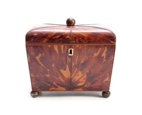 AN EARLY 19TH CENTURY TORTOISESHELL TEA CADDY of tapering form with rounded corners having silver wire inlays, the hinged lid