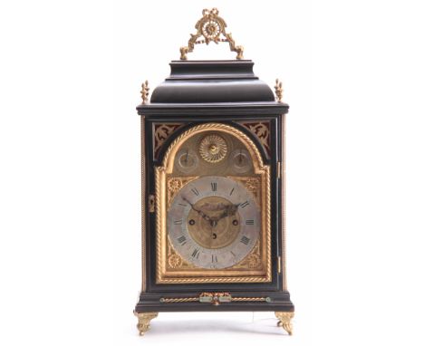 A MID 18TH CENTURY AUSTRIAN QUARTER CHIMING VERGE BRACKET CLOCK the ebonised case with inverted bell top pediment above a gla