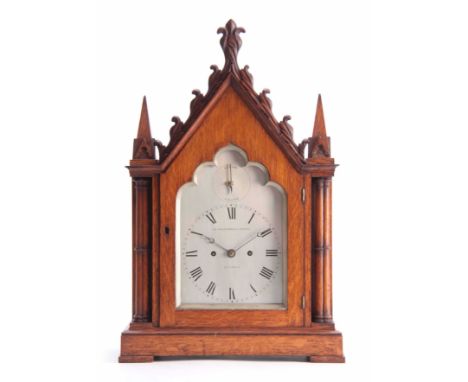 LE PLASTRIER &amp; YOUNG, LONDON A MID 19th CENTURY GOTHIC OAK BRACKET CLOCK the architectural oak case having a glazed door 