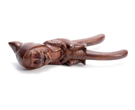 A LATE 19TH CENTURY SWISS BLACK FOREST NUTCRACKER formed as a gnome 25cm overall. 